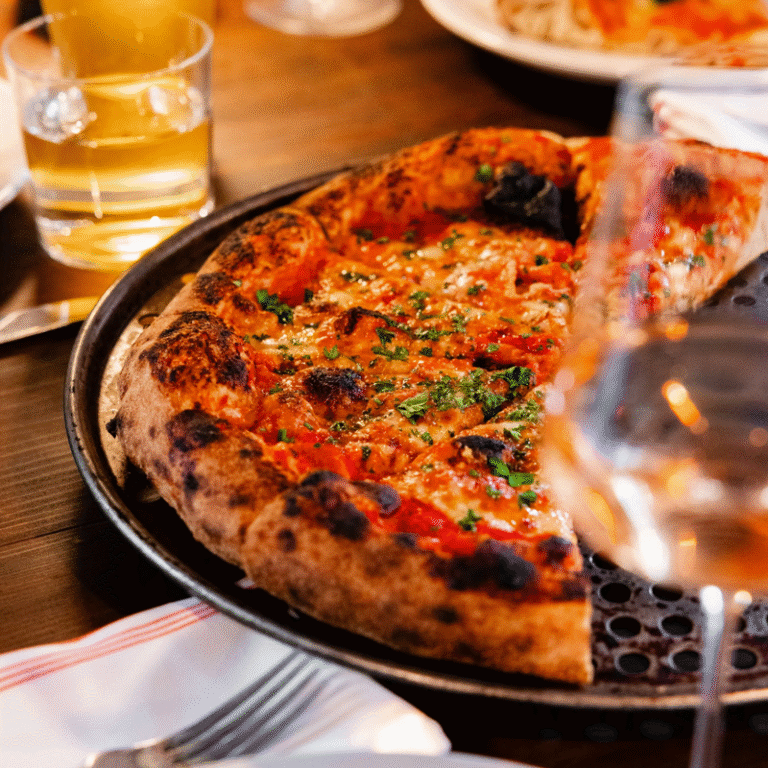Pizza Grace, Morris Avenue, closeup on pizza next to drink glasses